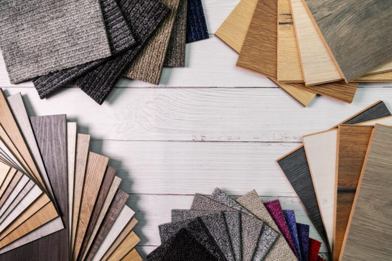 Wood, laminate, and carpet flooring samples for a renovation
